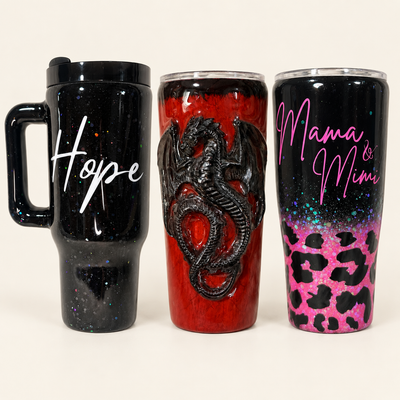 Marilu's Hope mug, red dragon tumbler and Mama & Mimi leopard tumbler on an ivory background