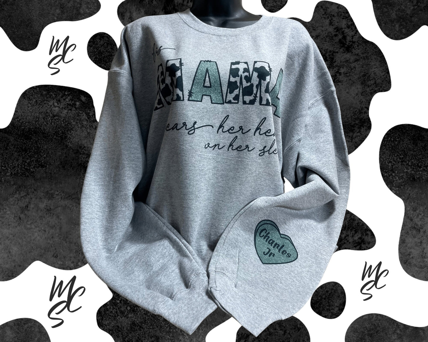 This MAMA wears her heart on her sleeve customizable/personalizeable Sweater sweatshirt tee in white or grey cow print.