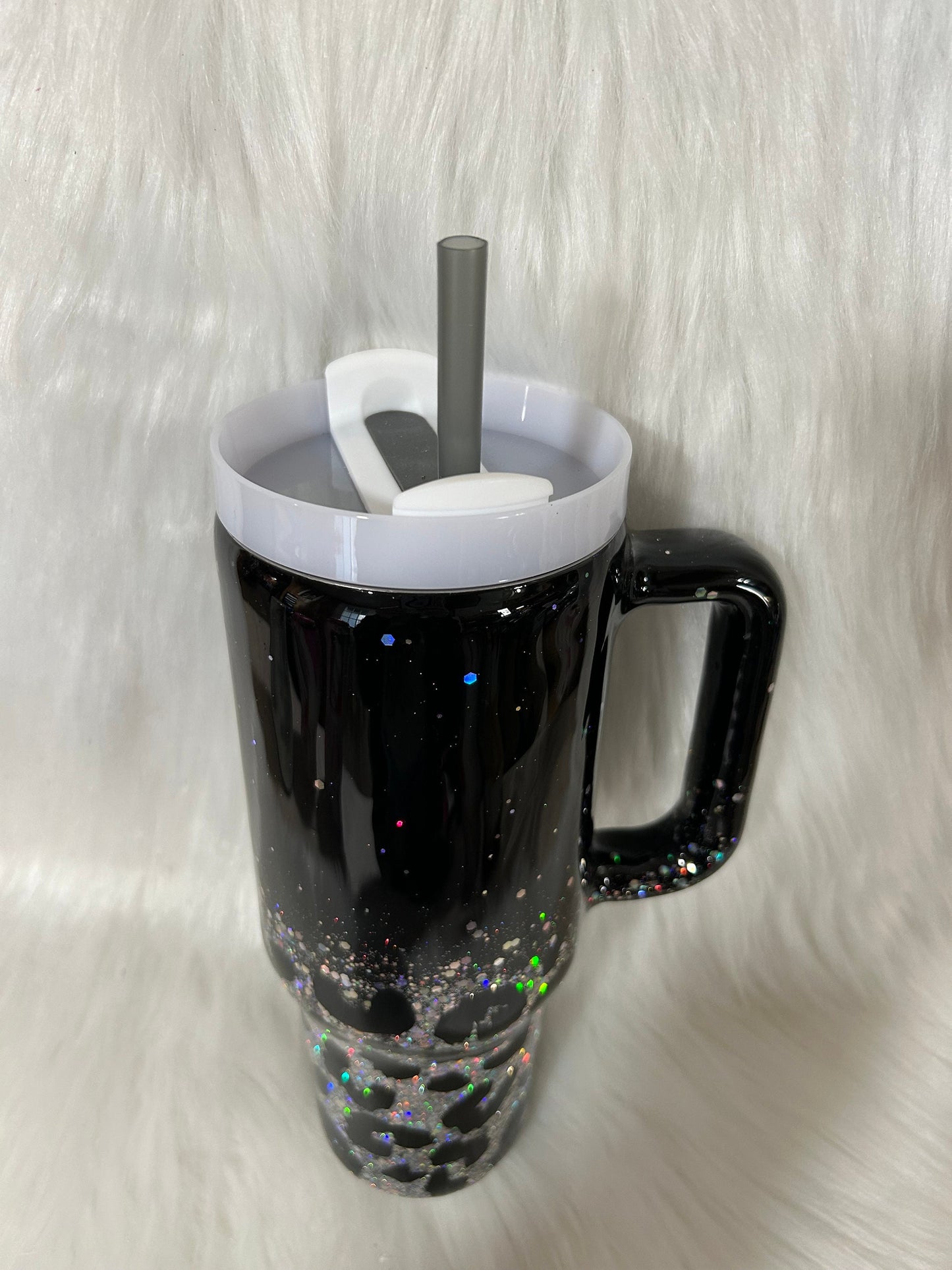 Leopard print tumbler on a black background and silver glitter, animal print cup, black and silver tumbler personalizeable with any name.