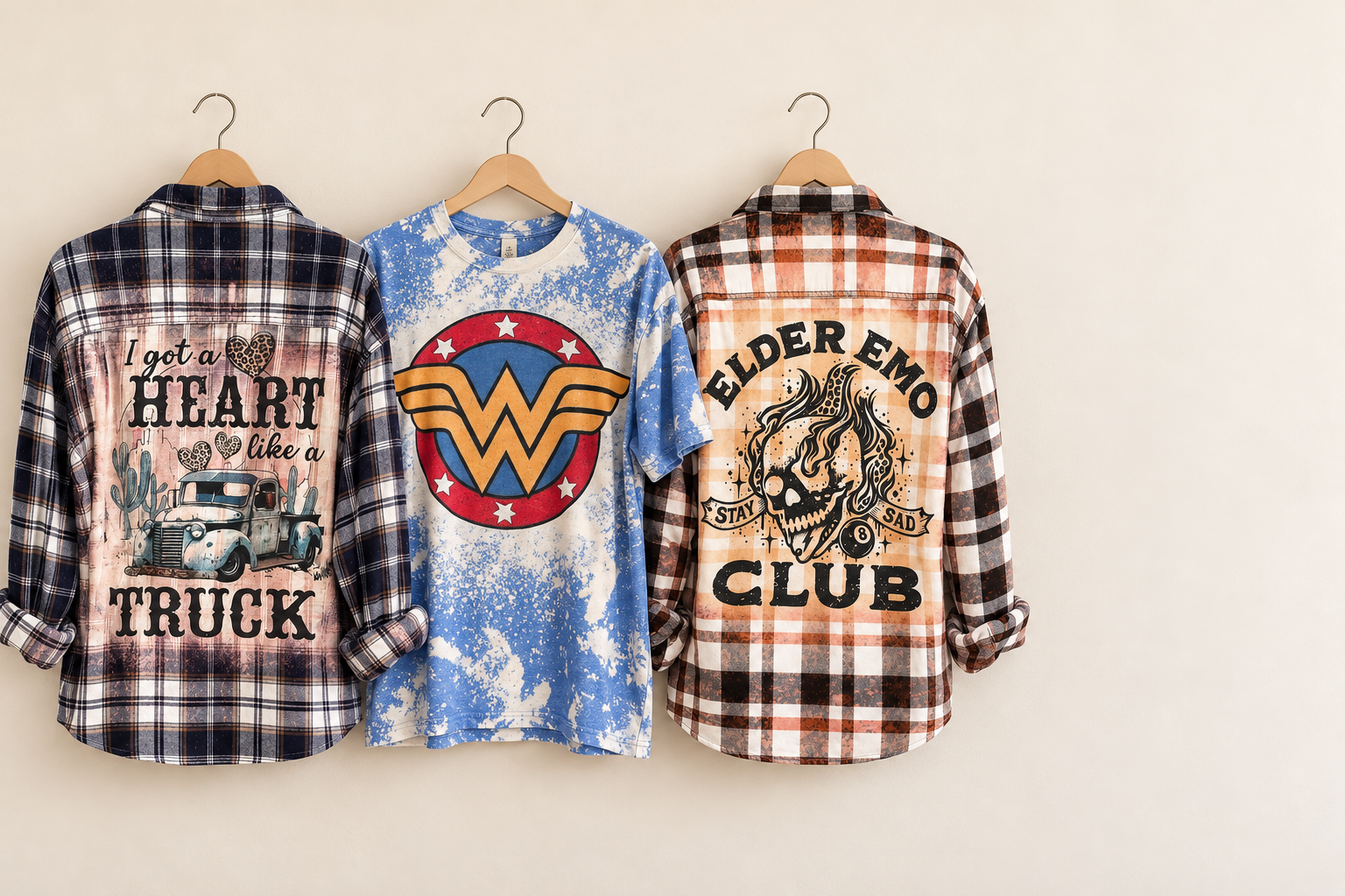 Apparel mockup featuring Heart Like a Truck flannel, blue Wonder Woman shirt and Elder Emo flannel